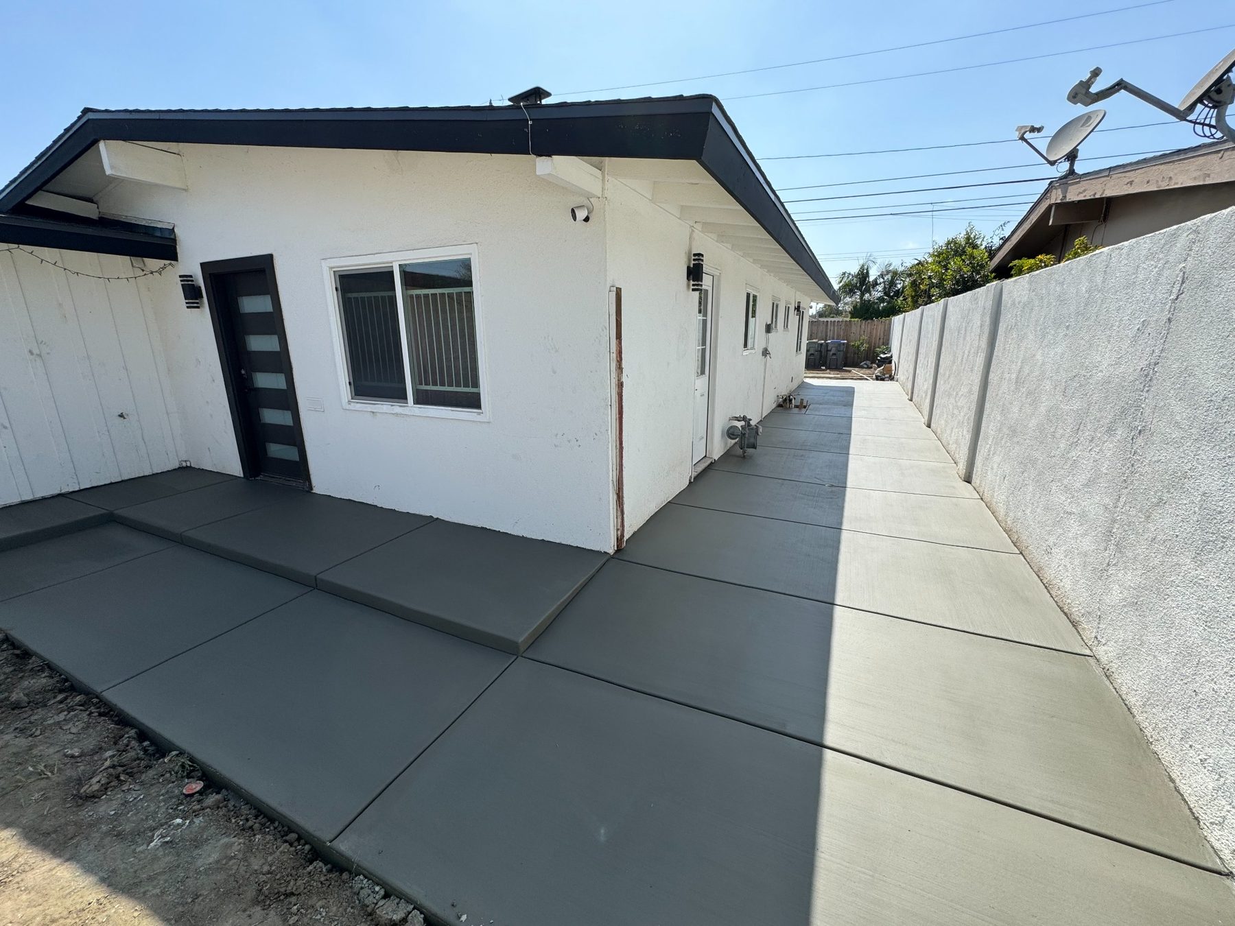 Finished Roman Concrete driveway and entry walkway at a home